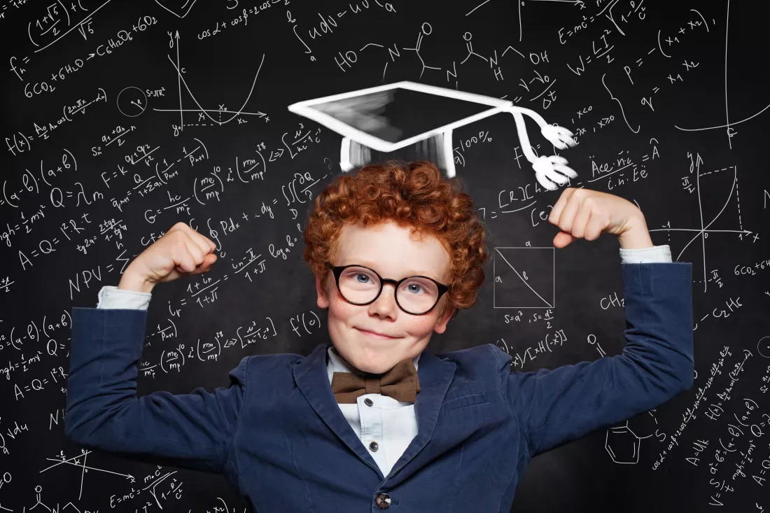 happy-funny-kid-student-blackboard-background-with-science-formulas